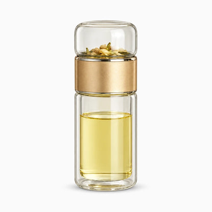 Bouteille isotherme pour thé avec couvercle doré et base en verre résistant