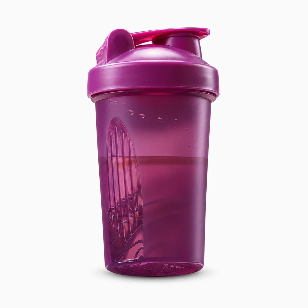 Gourde shaker multicolore : noir, vert et rose, rangée ensemble